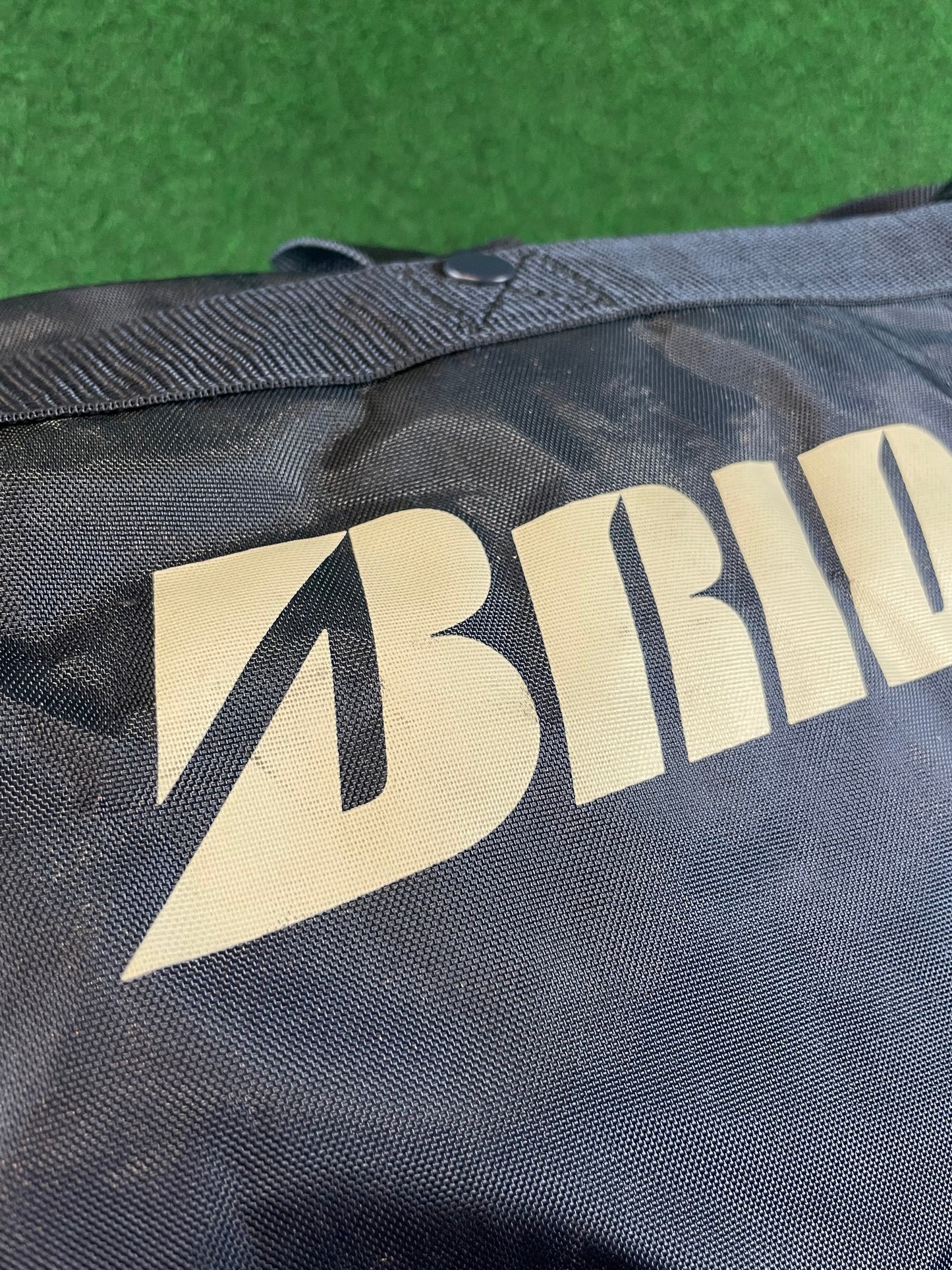 BRIDGESTONE - Vintage Navy Blue w/ White Lettering Red Duffle Bag